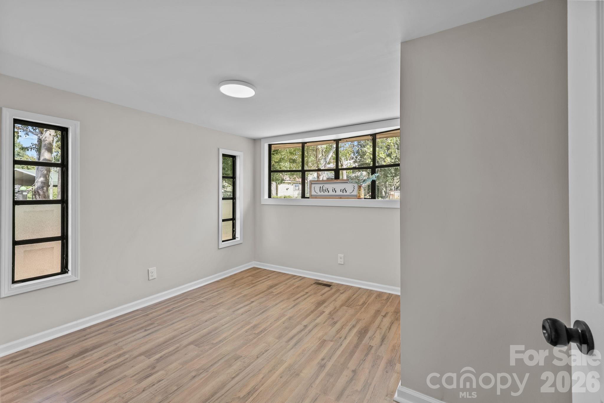 1315 King Road Salisbury, NC 28146 - Photo 23 of 41 a view of empty room with wooden floor and fan