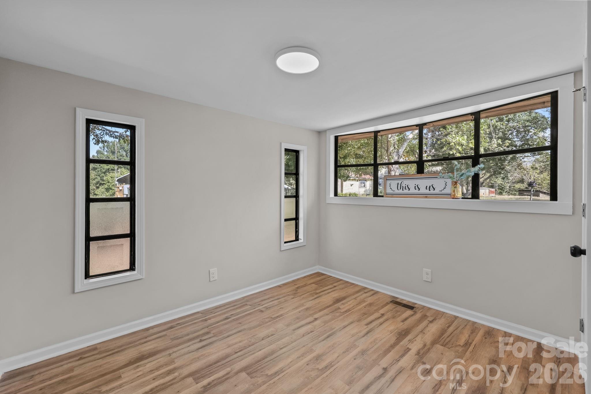 1315 King Road Salisbury, NC 28146 - Photo 24 of 41 a view of empty room with wooden floor and fan