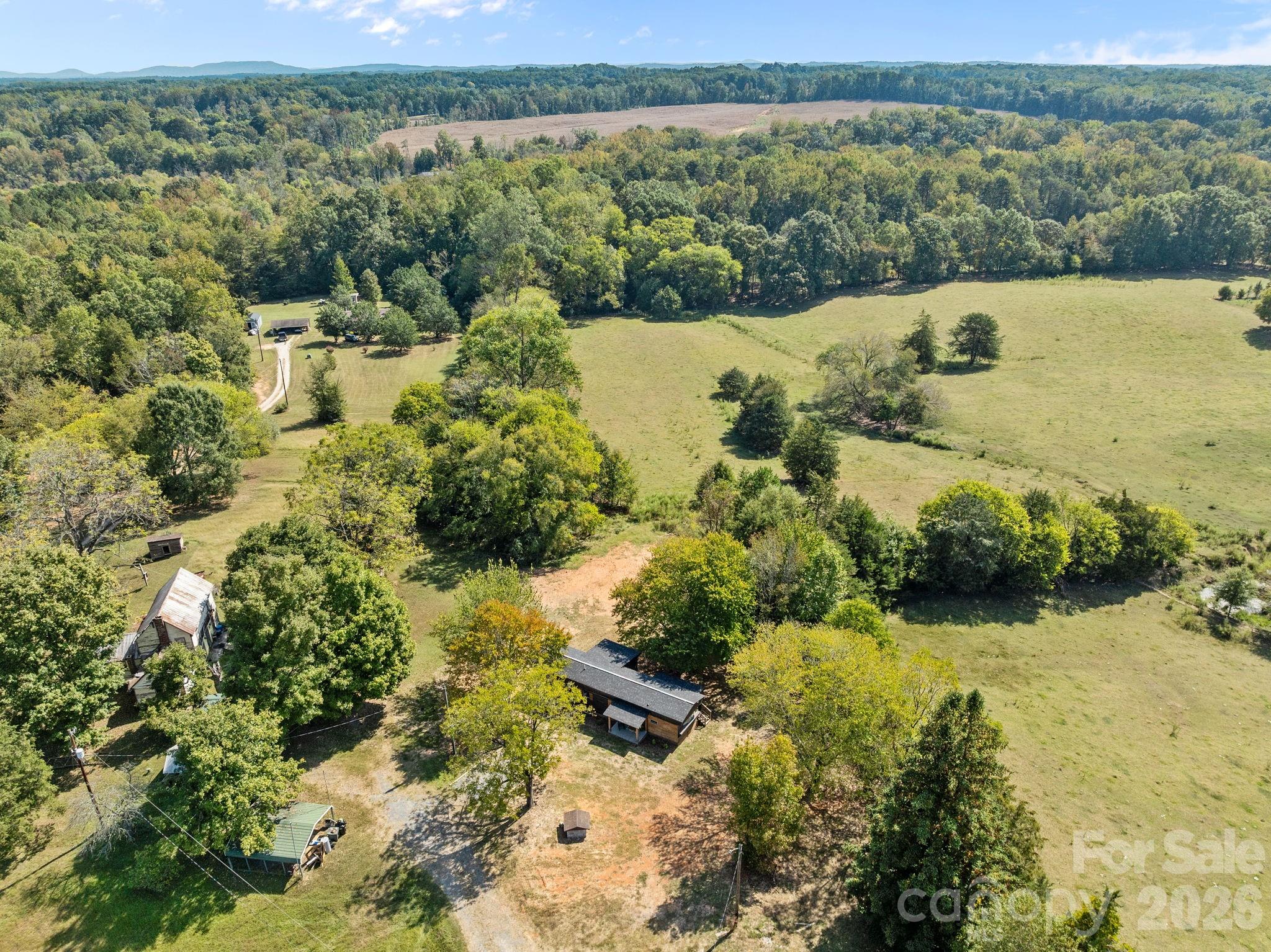 1315 King Road Salisbury, NC 28146 - Photo 33 of 41 a view of a lake with a mountain in the background