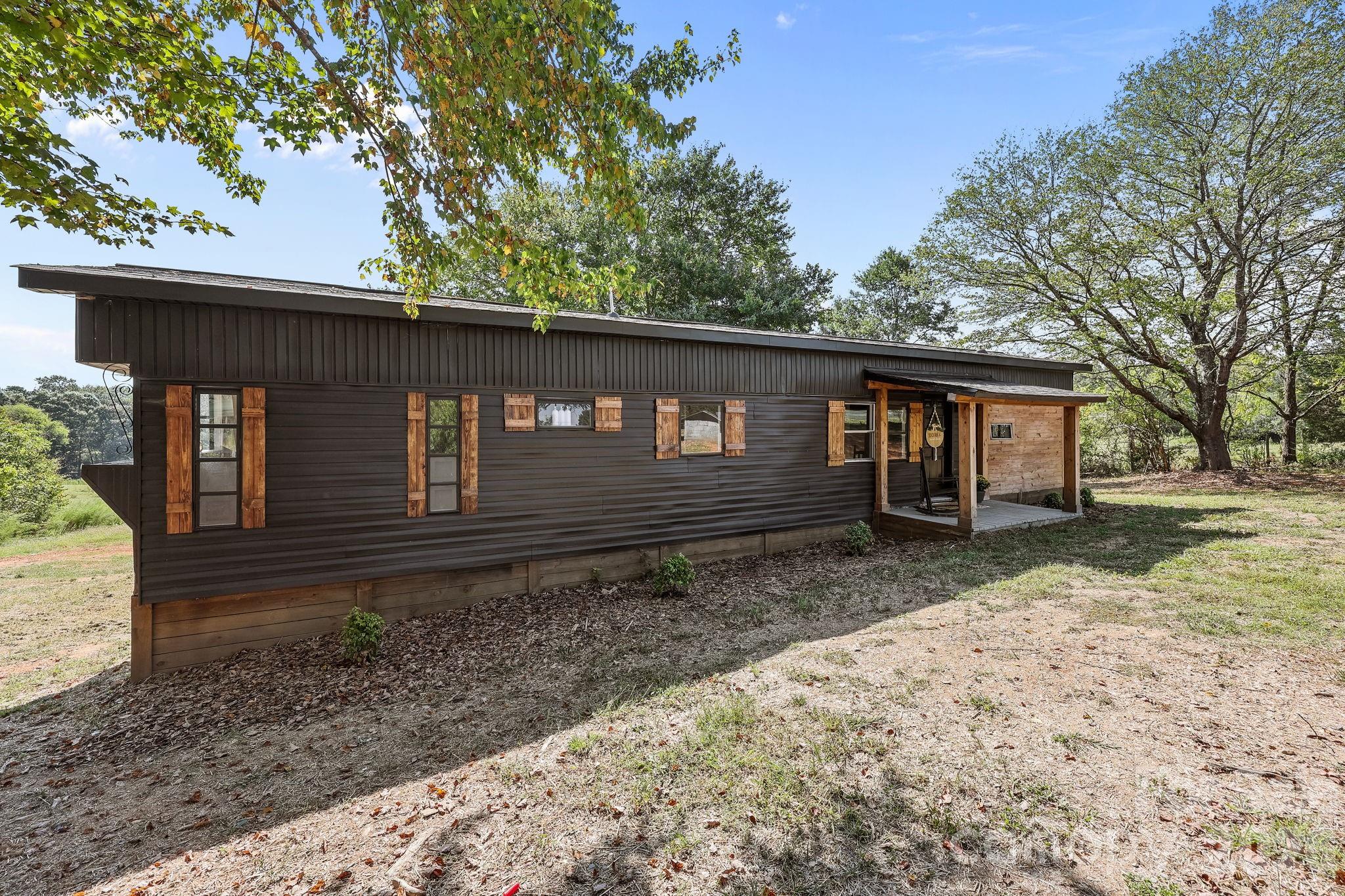 1315 King Road Salisbury, NC 28146 - Photo 4 of 41 a front view of a house with garden