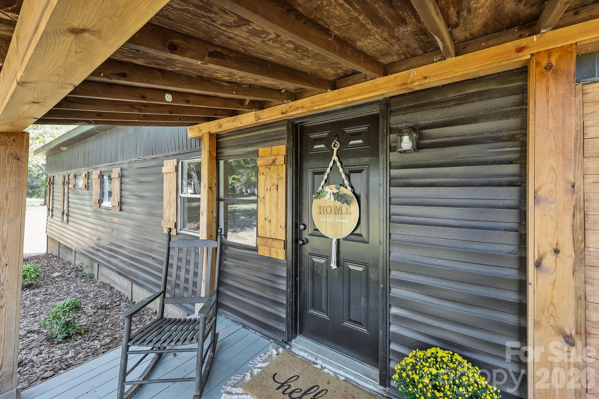 1315 King Road Salisbury, NC 28146 - Photo 6 of 41 a view of a porch with a table and chairs