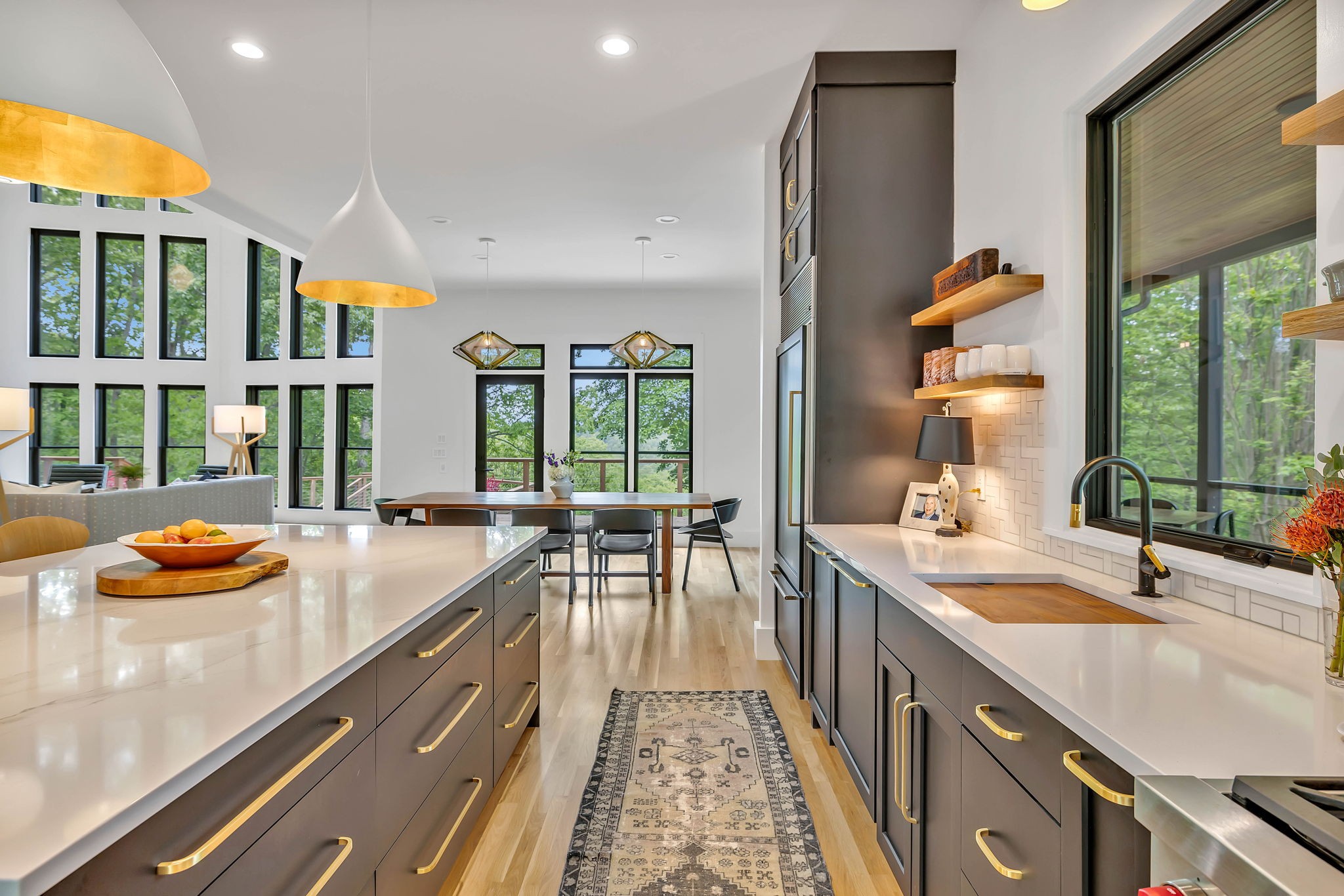 8548 Cub Creek Road Nashville, TN 37209 - Photo 11 of 43 a kitchen with a sink and large windows