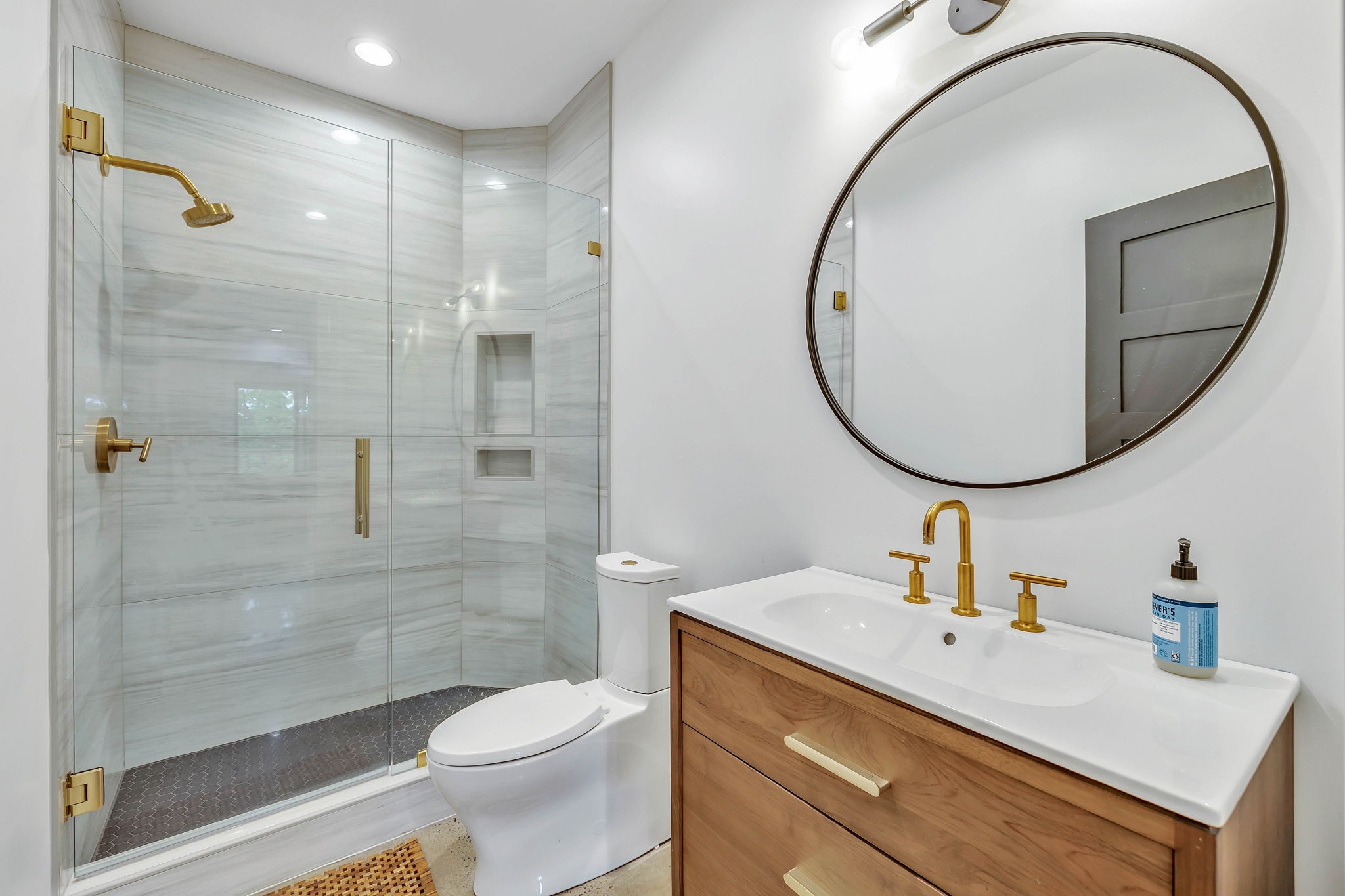 8548 Cub Creek Road Nashville, TN 37209 - Photo 32 of 43 a bathroom with a sink a toilet and a mirror