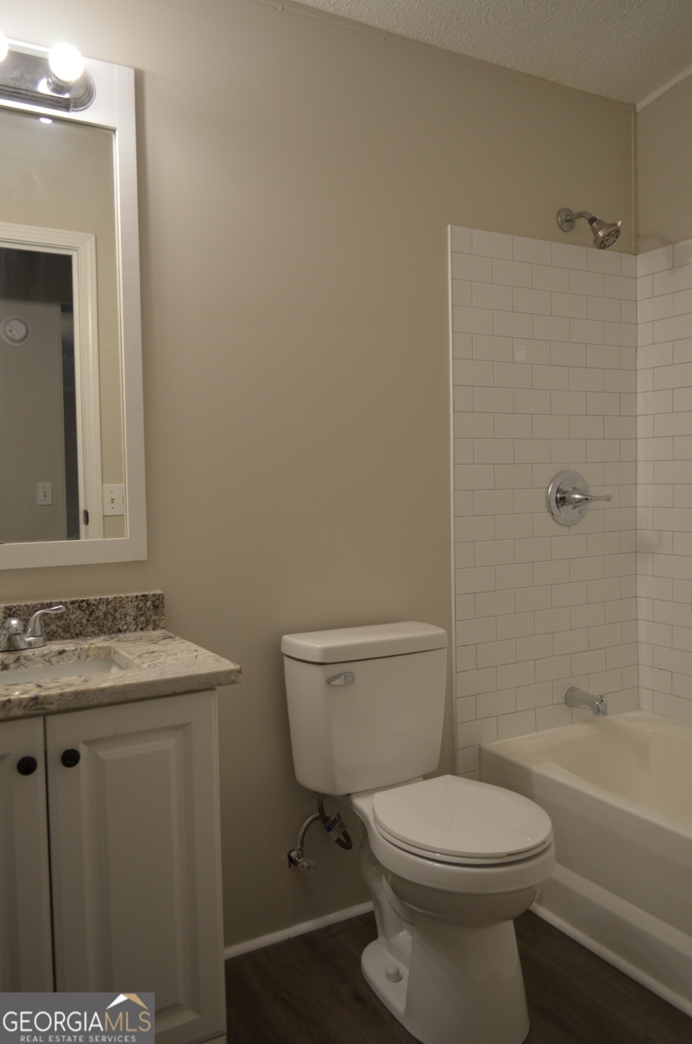 1048 Lee King Road Forsyth, GA 31029 - Photo 15 of 19 a bathroom with a toilet a sink and bathtub
