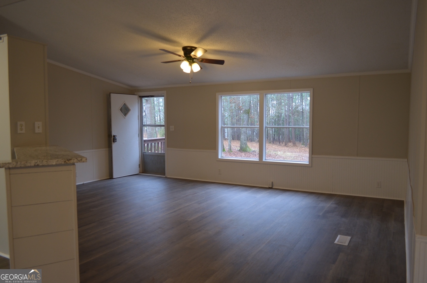 1048 Lee King Road Forsyth, GA 31029 - Photo 2 of 19 a view of a livingroom with a ceiling fan and window