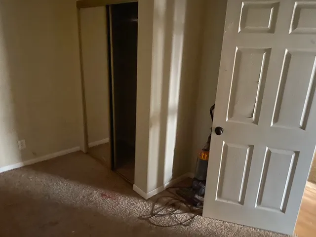 a kitchen with a stove a sink and a refrigerator