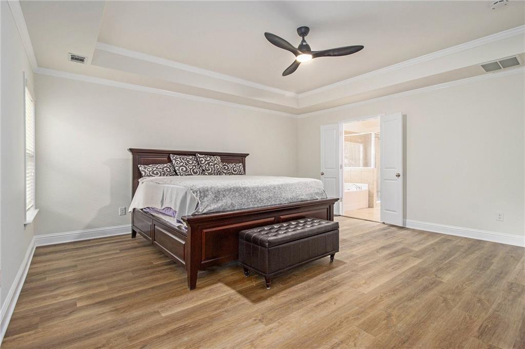 218 Third Avenue Avondale Estates, GA 30002 - Photo 2 of 26 a bed room with a bed and a ceiling fan