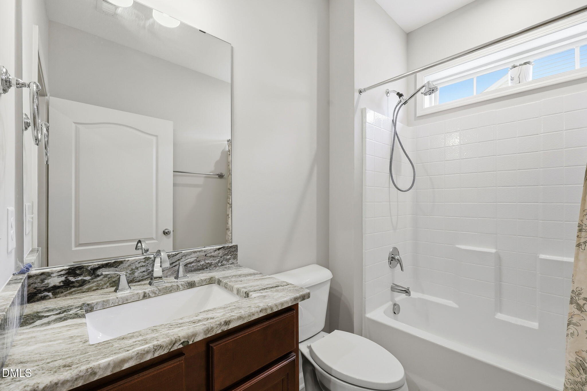 522 Brunello Drive Wake Forest, NC 27587 - Photo 13 of 24 a bathroom with a granite countertop sink toilet a mirror and shower