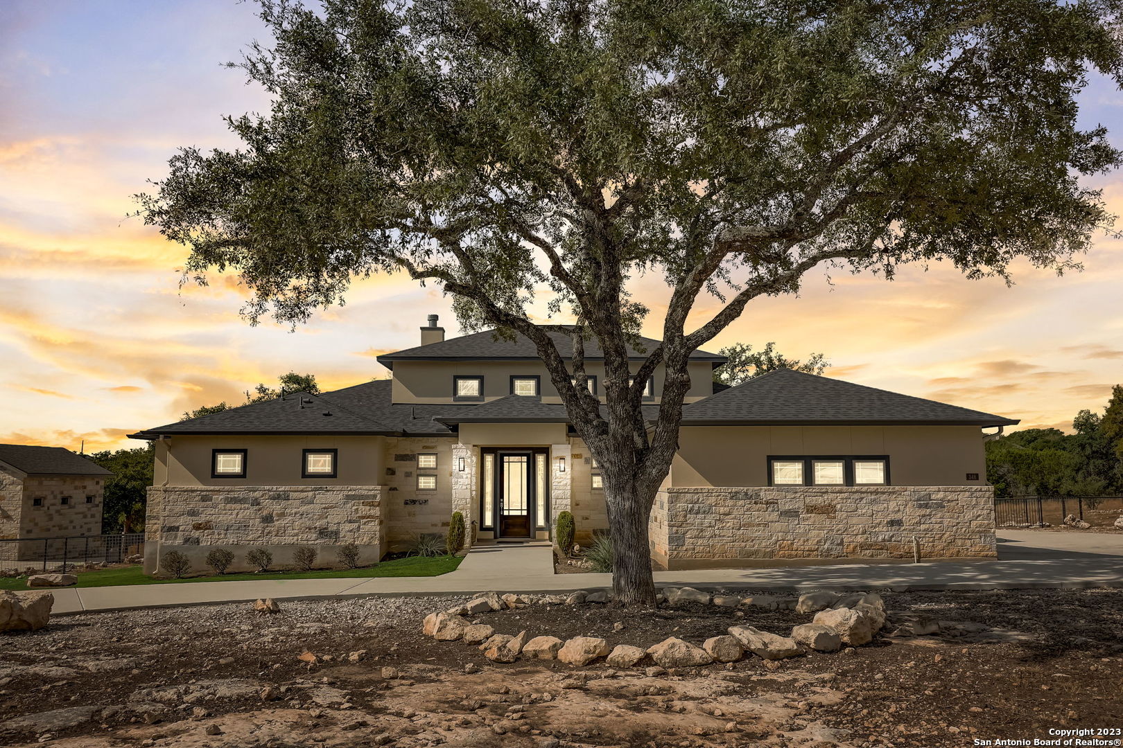 a front view of a house with a yard