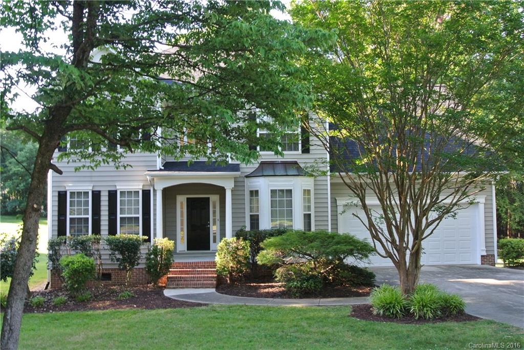 10100 White Cascade Drive Charlotte, NC 28269 - Photo 1 of 19 a front view of a house with garden and porch