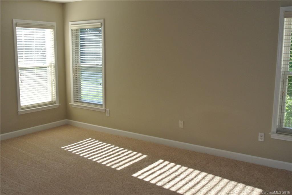 10100 White Cascade Drive Charlotte, NC 28269 - Photo 11 of 19 a view of an empty room with a window