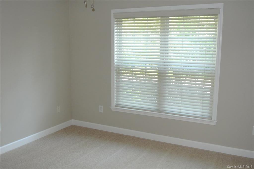 10100 White Cascade Drive Charlotte, NC 28269 - Photo 13 of 19 an empty room with a window