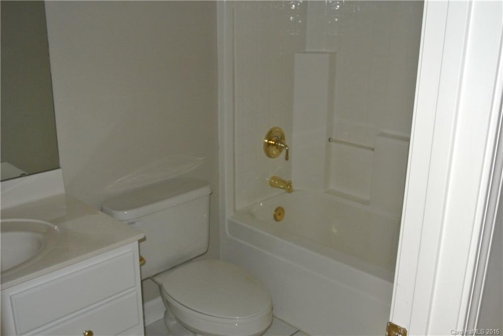 10100 White Cascade Drive Charlotte, NC 28269 - Photo 15 of 19 a bathroom with a toilet and a bathtub