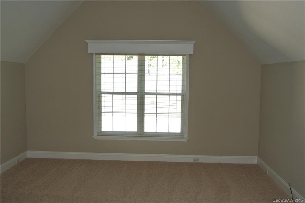 10100 White Cascade Drive Charlotte, NC 28269 - Photo 16 of 19 an empty room with a window