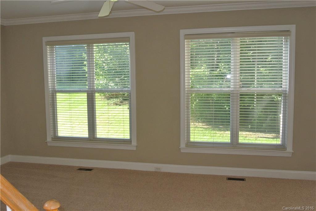 10100 White Cascade Drive Charlotte, NC 28269 - Photo 6 of 19 a view of an empty room with a window