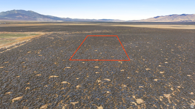 18150 West County Road, Unit 14 Cedar Valley, UT 84013 - Photo 3 of 4 Expansive undeveloped land featuring natural desert vegetation, a level topography, and a distant mountain range backdrop. (LOCATION/BOUNDARIES HIGHLIGHTED)