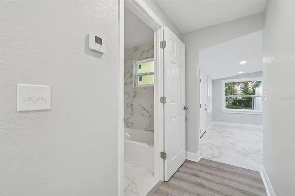 a view of a bathroom with a glass door shower