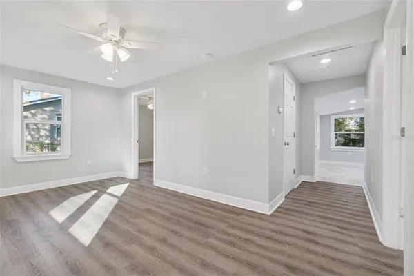wooden floor in an empty room with a window