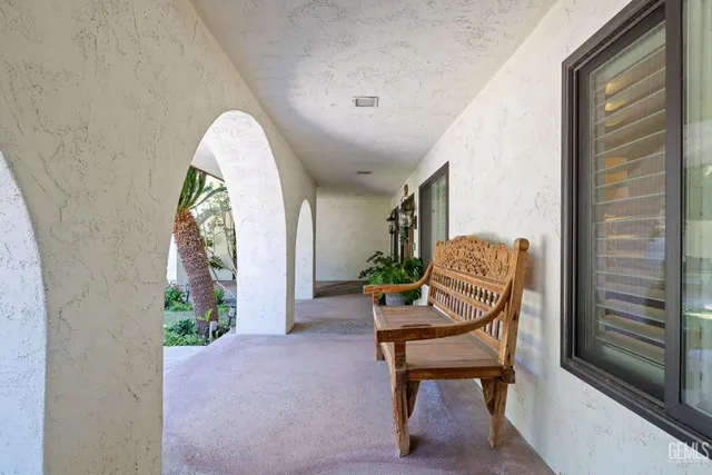 a view of a swimming pool with an outdoor seating