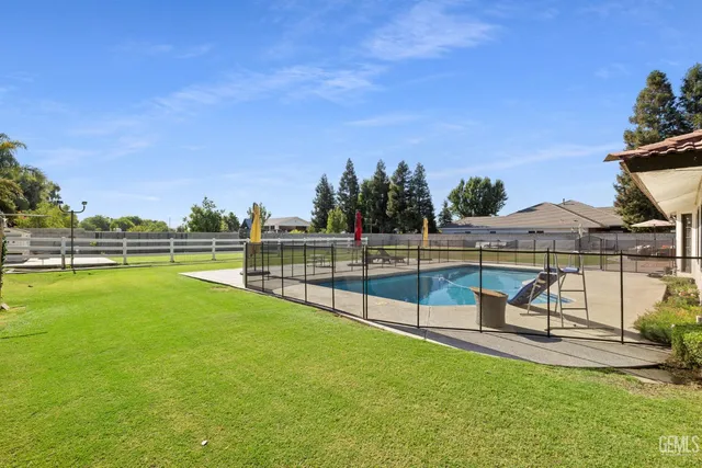a view of a swimming pool with a patio
