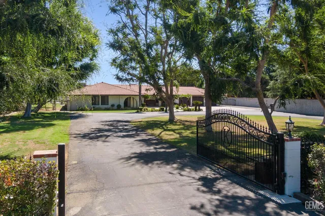 a view of a park with large trees