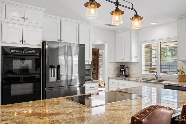 a view of a hallway with white walls and stairs