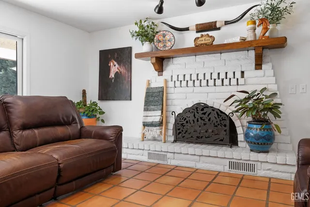 a bedroom with a large bed and a flat screen tv