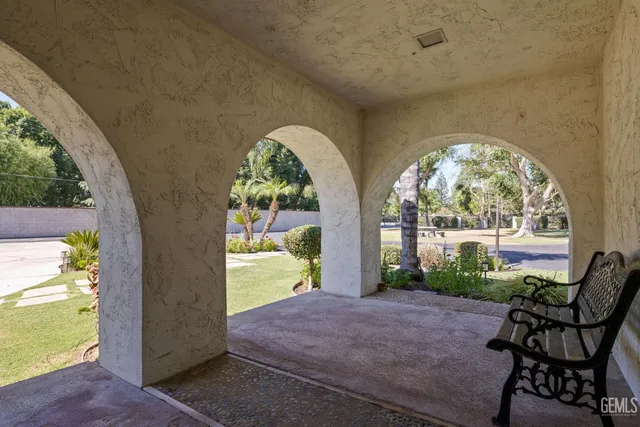 a view of swimming pool with outdoor seating and city view