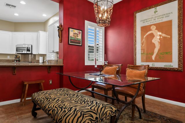 a kitchen with cabinets appliances and a sink