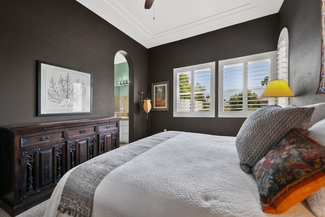 a bathroom with a sink double vanity and painting on the wall