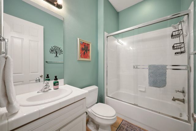 a backyard of a house with outdoor seating