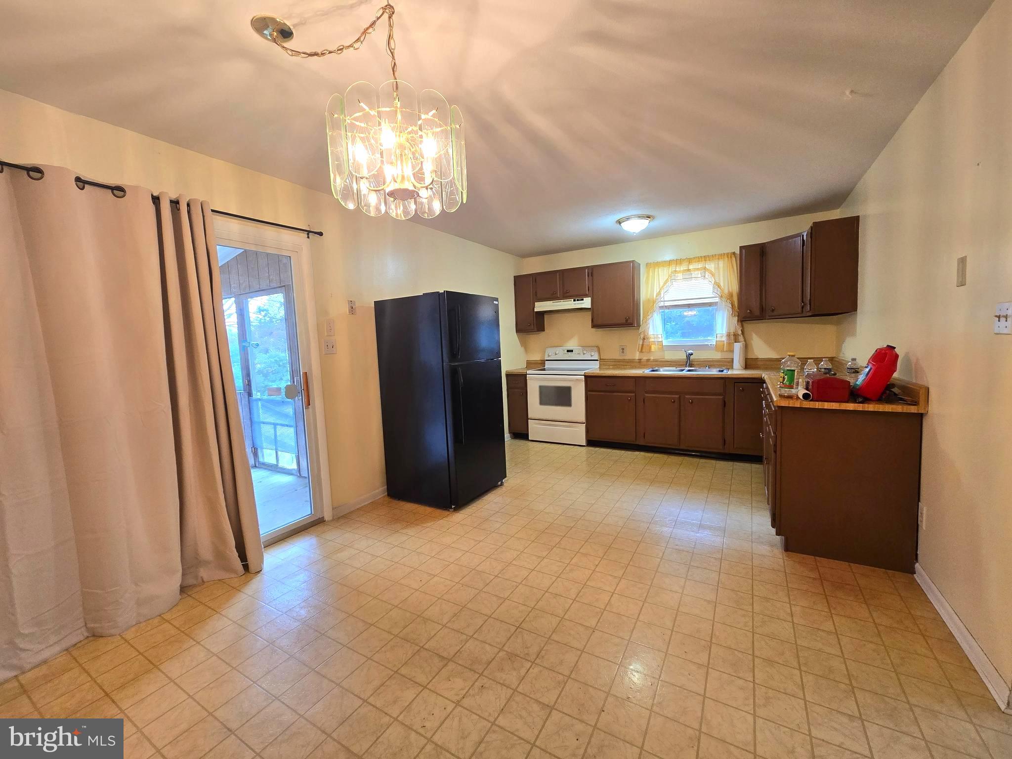 1630 Liberty Grove Road Conowingo, MD 21918 - Photo 2 of 18 a kitchen with stainless steel appliances granite countertop a refrigerator and a stove top oven