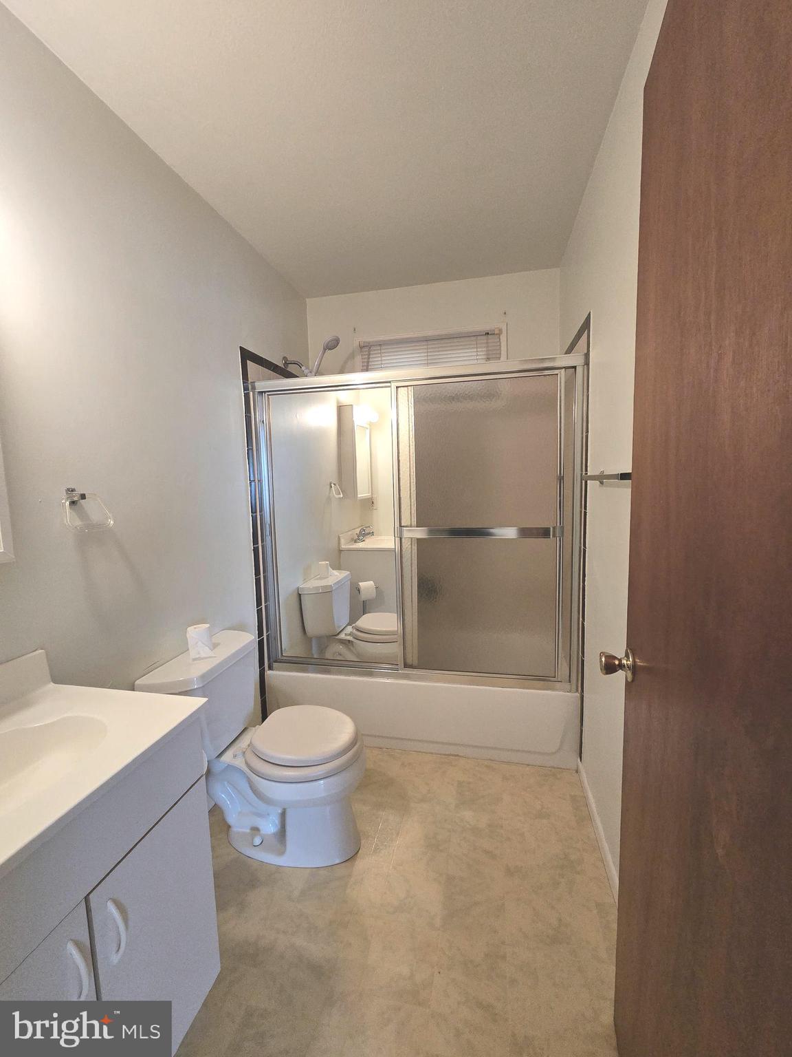 1630 Liberty Grove Road Conowingo, MD 21918 - Photo 5 of 18 a bathroom with a granite countertop sink toilet and shower