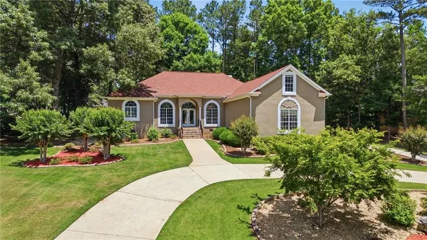 a front view of a house with a yard
