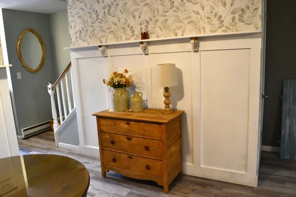 a room with a mirror and furniture