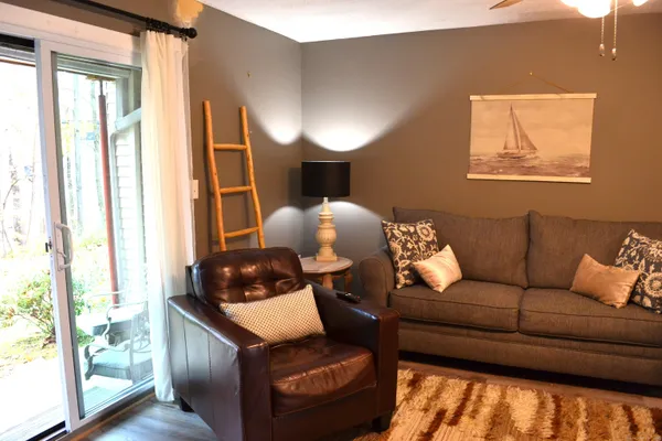 a living room with furniture and a window