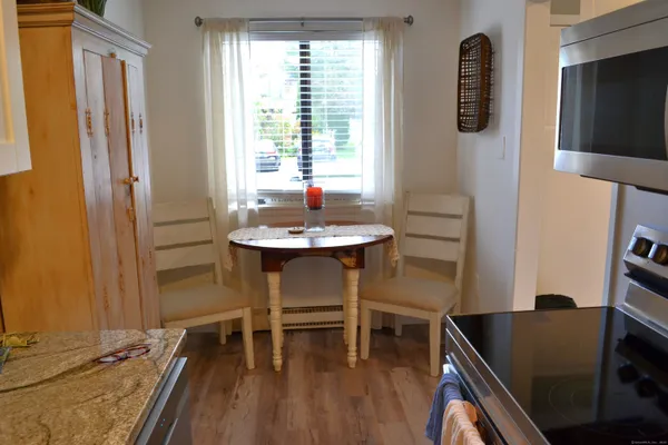 a dining room with furniture and window