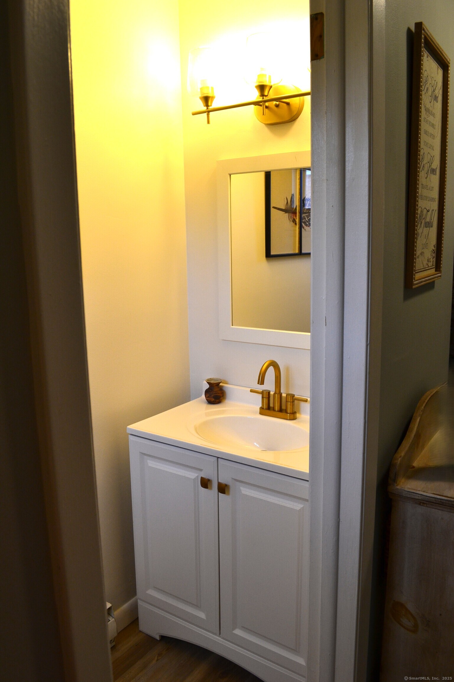 41 Mountain Laurel Court, Unit 41 Cromwell, CT 06416 - Photo 9 of 16 a bathroom with a sink and a mirror