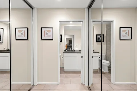 a bathroom with a tub shower vanity and a sink