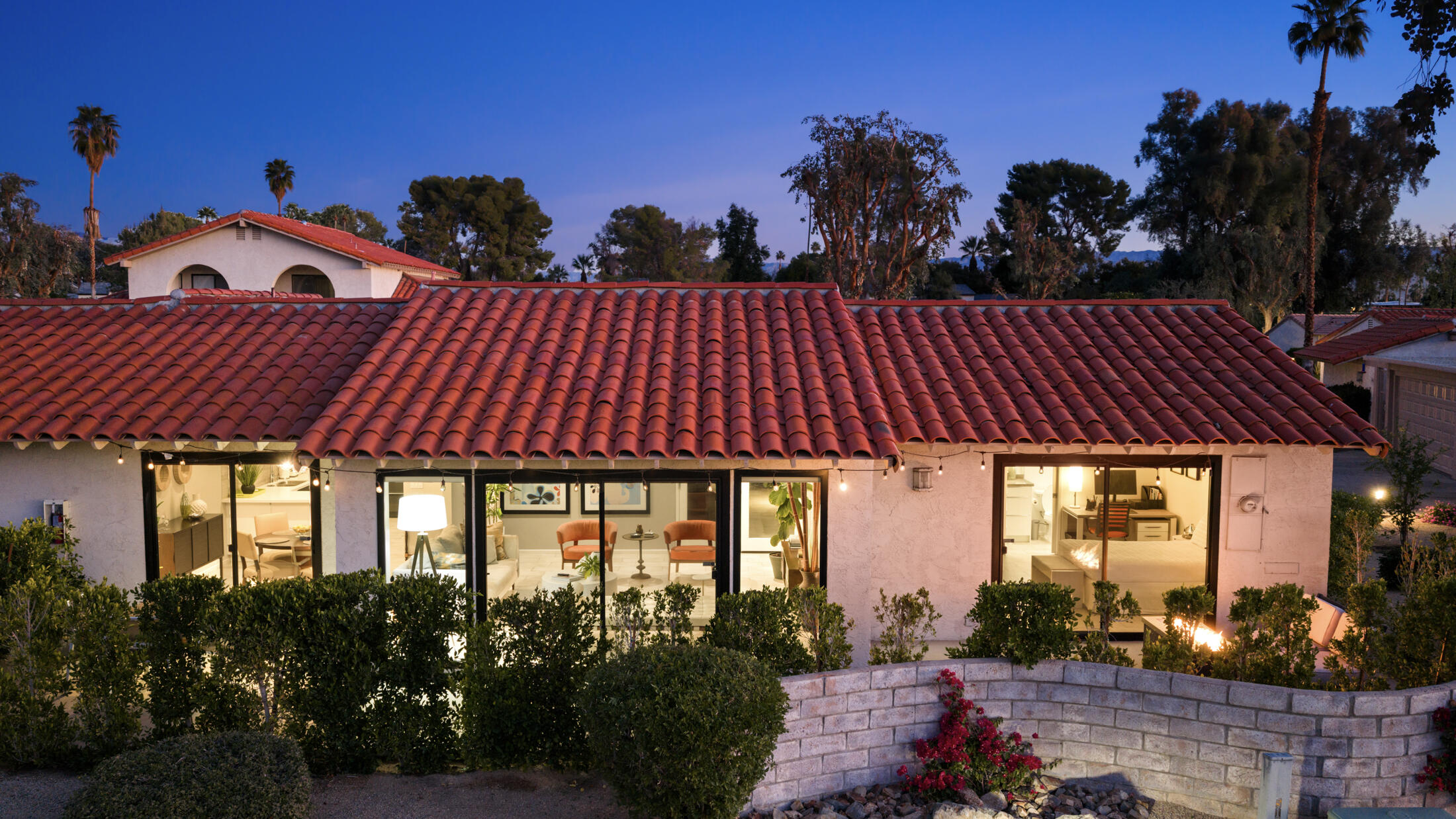 6155 East Driver Road Palm Springs, CA 92264 - Photo 2 of 22 a front view of a house with a garden
