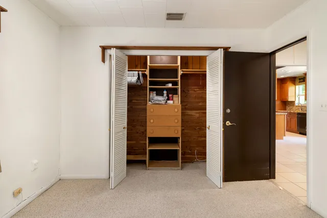 a bathroom with a sink vanity mirror and toilet