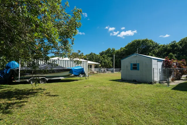 a house with swimming pool in front of it