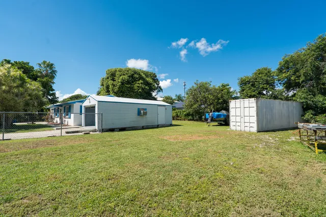 a couple of flower plants in front of door