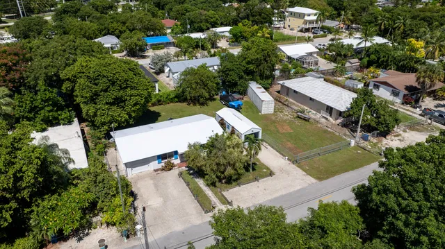 an aerial view of a house with a garden