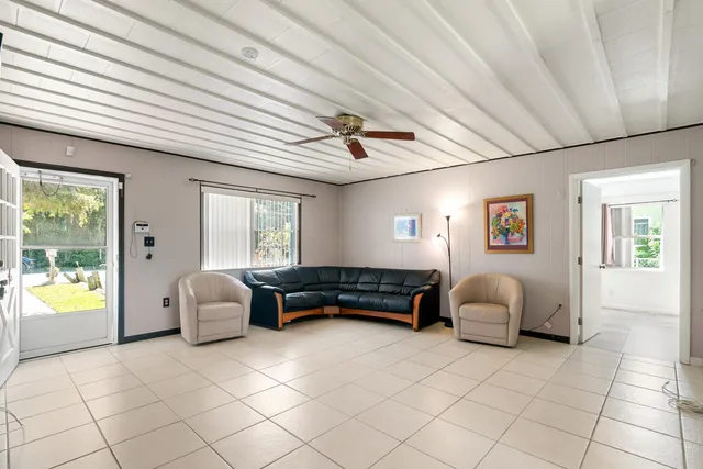 a living room with furniture and a window
