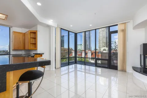 a view of hallway with furniture and a floor to ceiling window