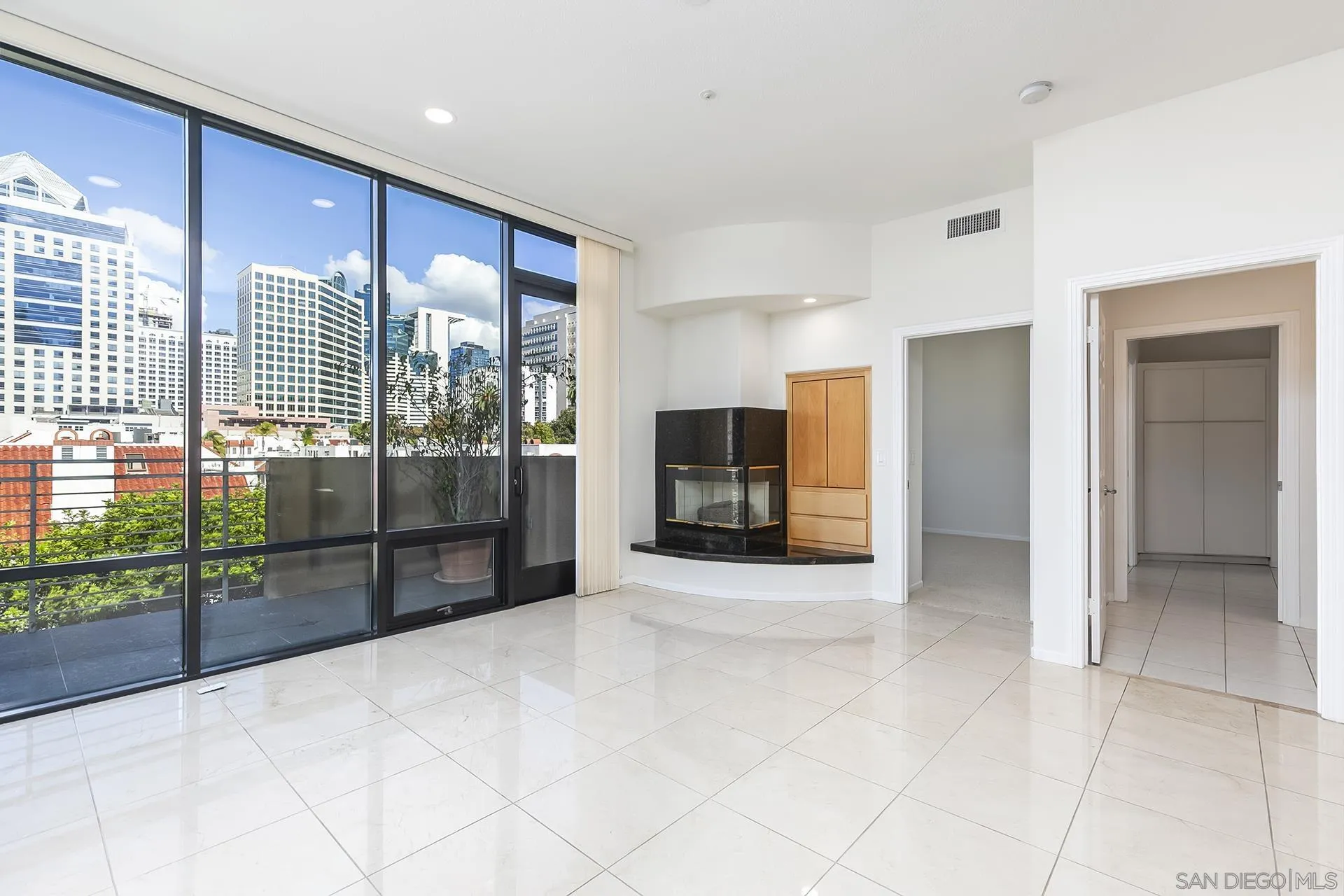 611 West G Street, Unit 321 San Diego, CA 92101 - Photo 14 of 28 a view of hallway with furniture and a floor to ceiling window