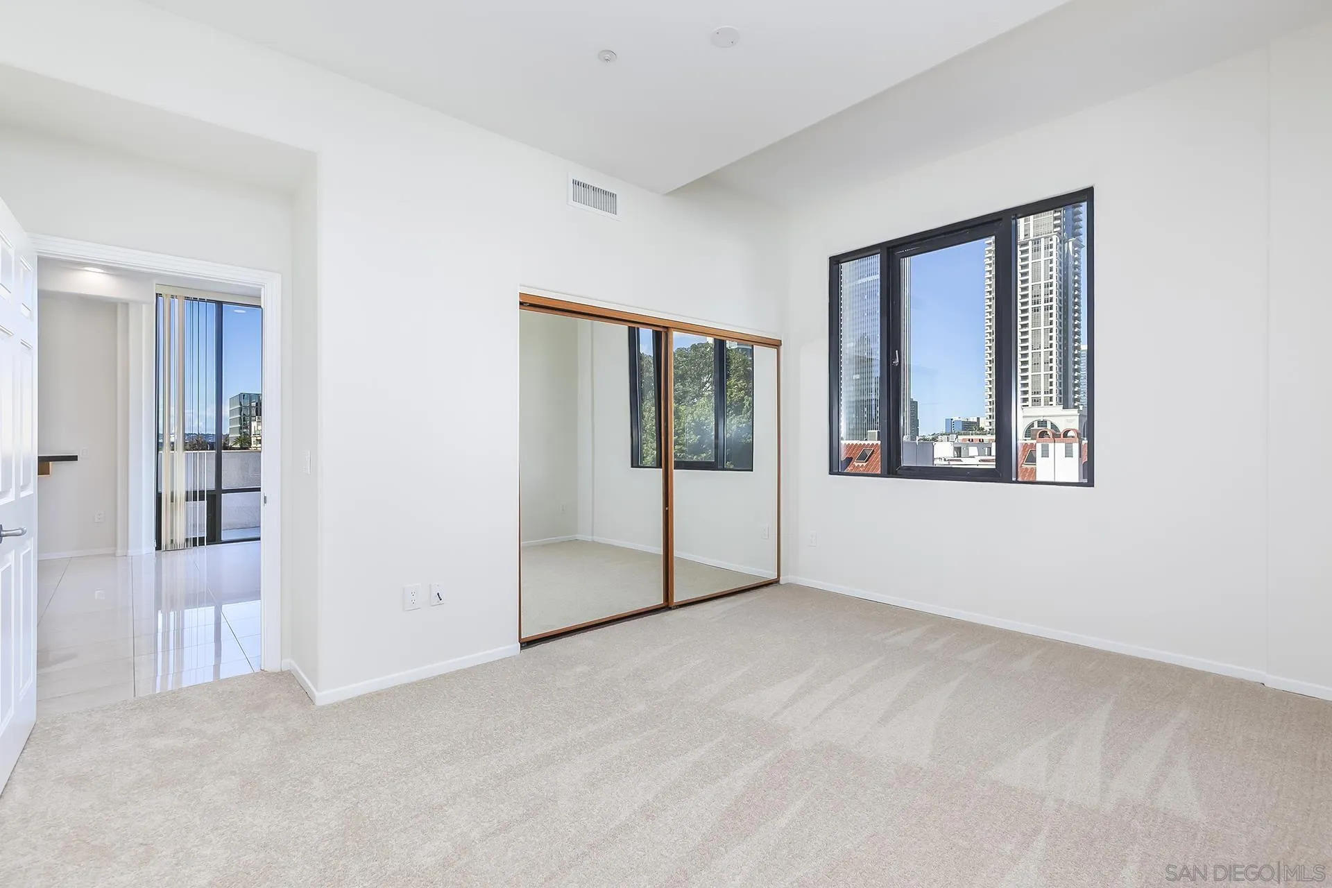 611 West G Street, Unit 321 San Diego, CA 92101 - Photo 19 of 28 an empty room with windows