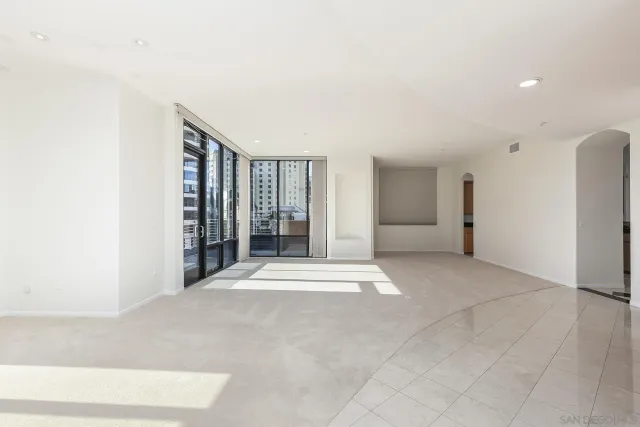 a view of a kitchen with furniture and a window