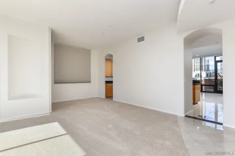a kitchen with stainless steel appliances granite countertop a sink counter space cabinets and a large window